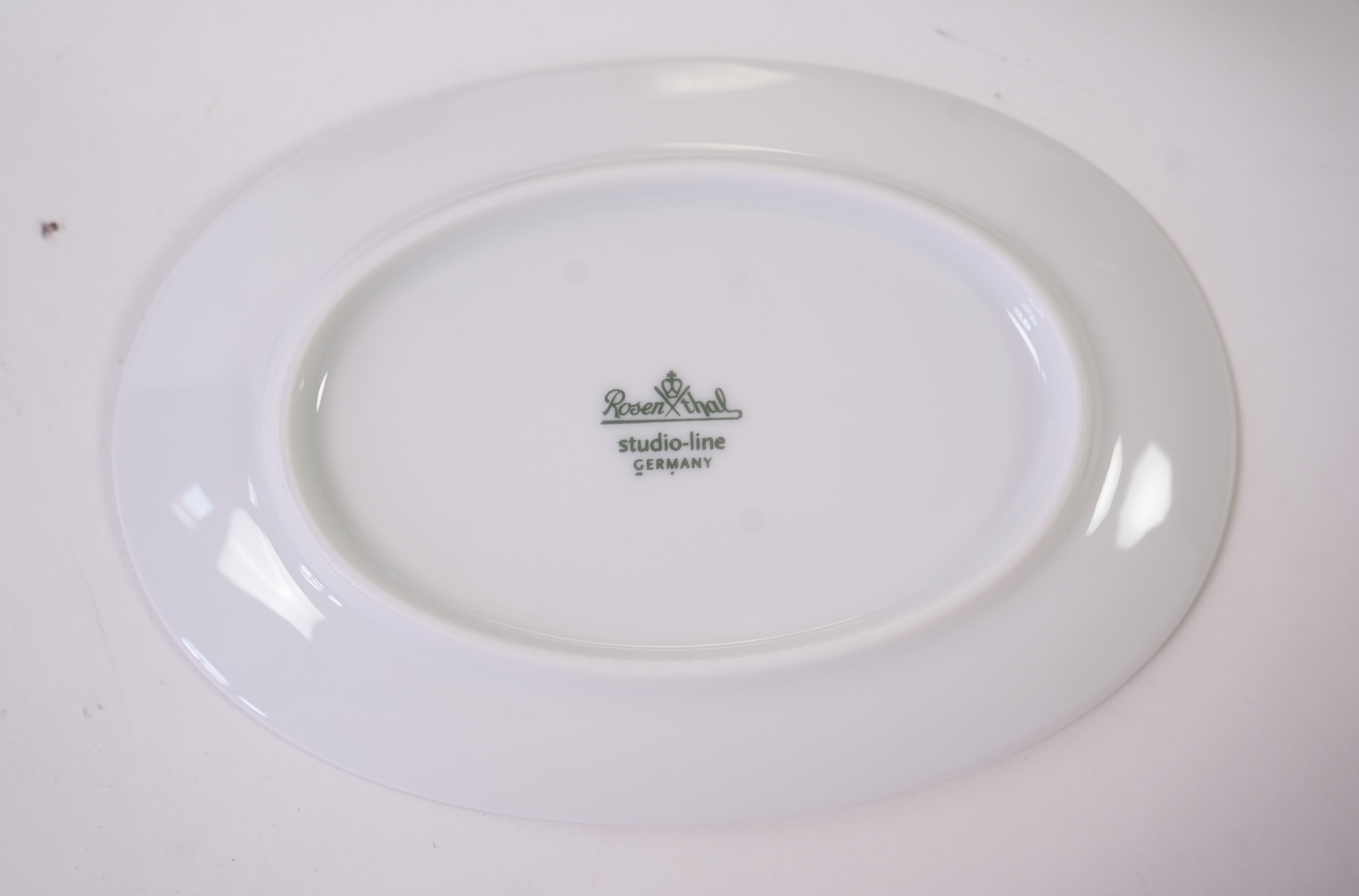 A collection of Rosenthal studio line TAC Gropius Skin platinum dinnerware, largest 33cm in diameter